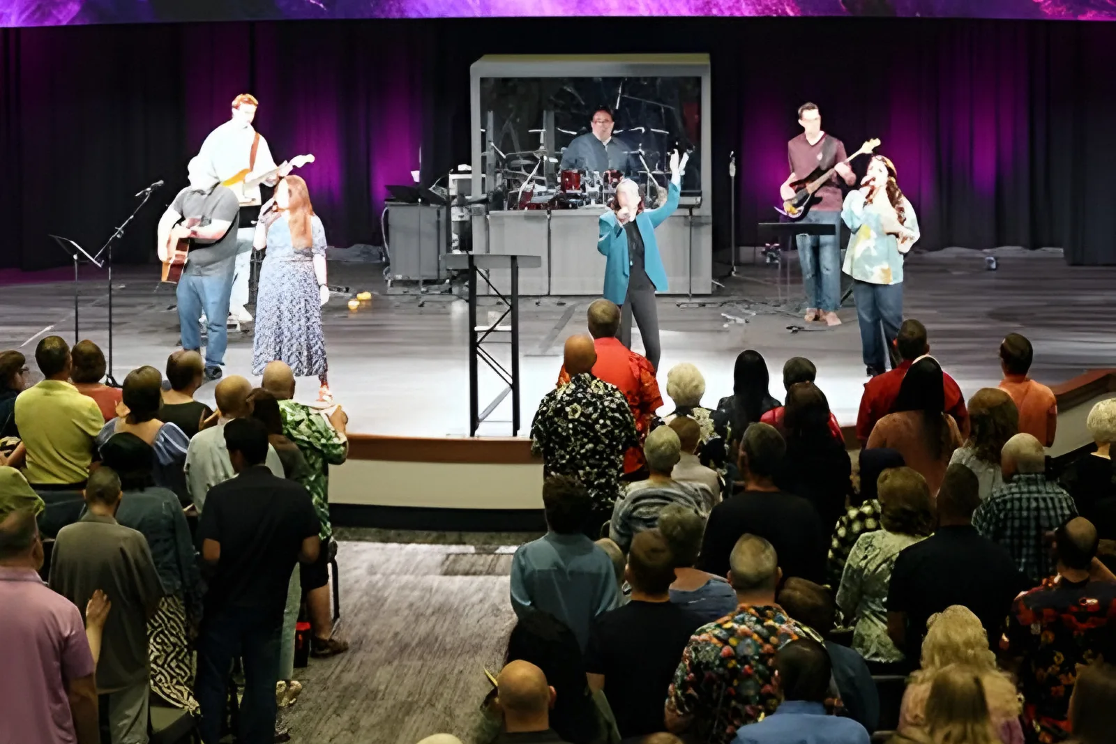 The worship band leading a full congregation