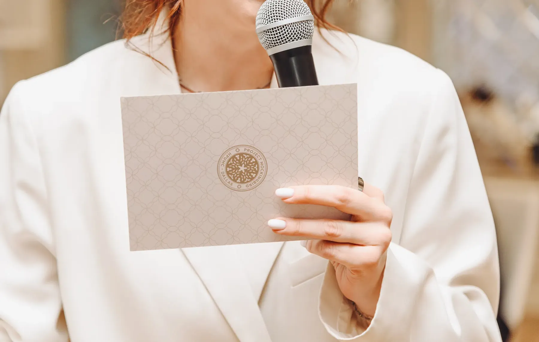 Speaker at a microphone holding a Project Mockingbird campaign card