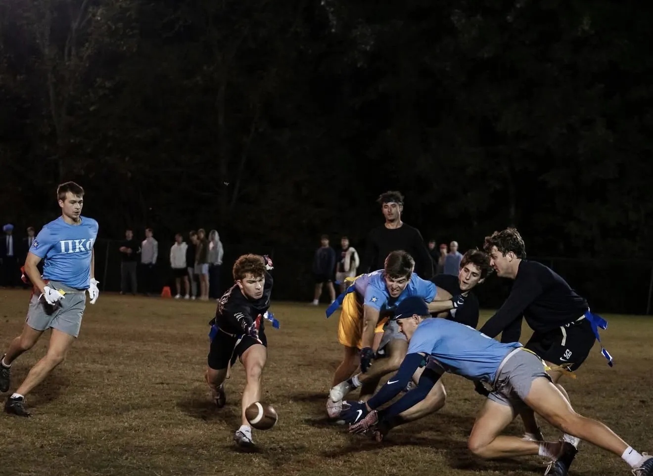 Players diving for the ball in a Samford flag football game