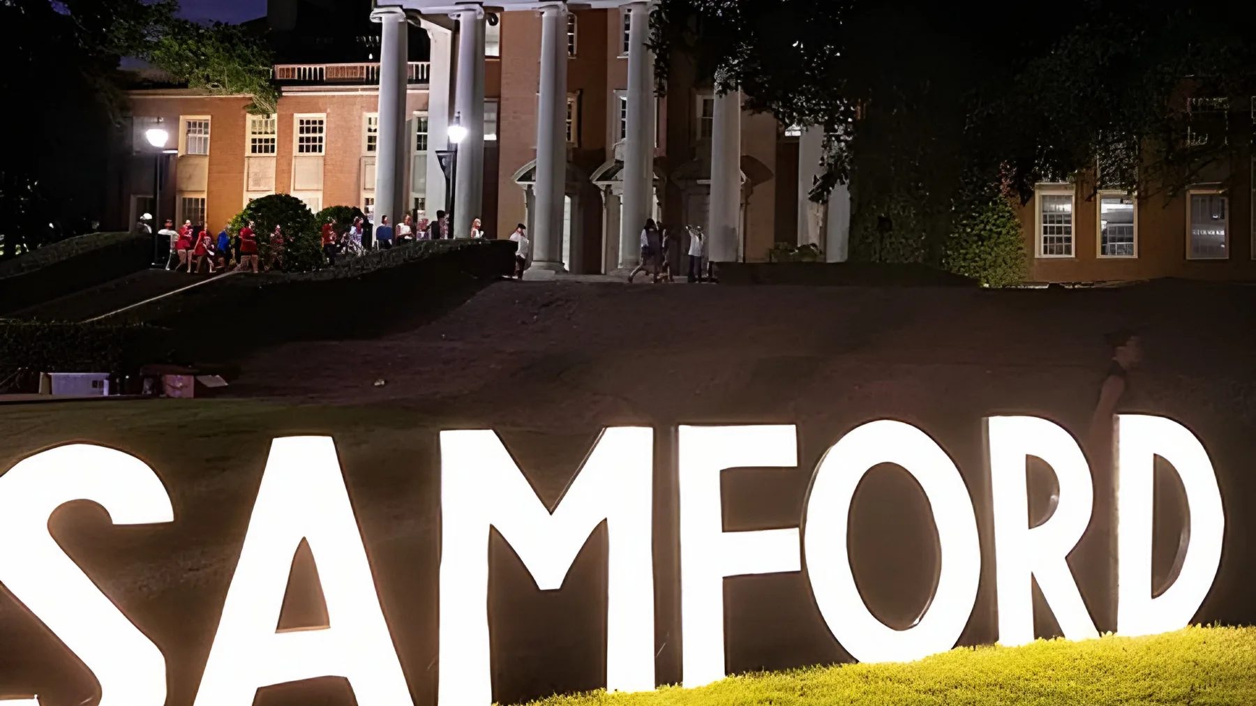 Lit SAMFORD letters on the lawn at night during Welcome Back Week